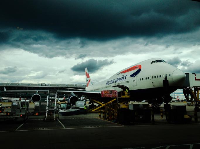 airplane airport luggage baggage british airways travel transportation clouds cloudy storm dark boarding